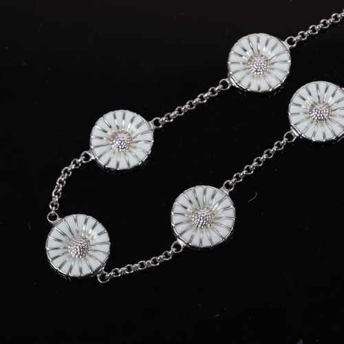 1471 - GEORG JENSEN - a modern Danish sterling silver and white enamel daisy pattern bracelet, designed by ... 