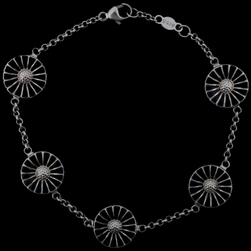 1472 - GEORG JENSEN - a modern Danish sterling silver and black enamel daisy pattern bracelet, designed by ... 