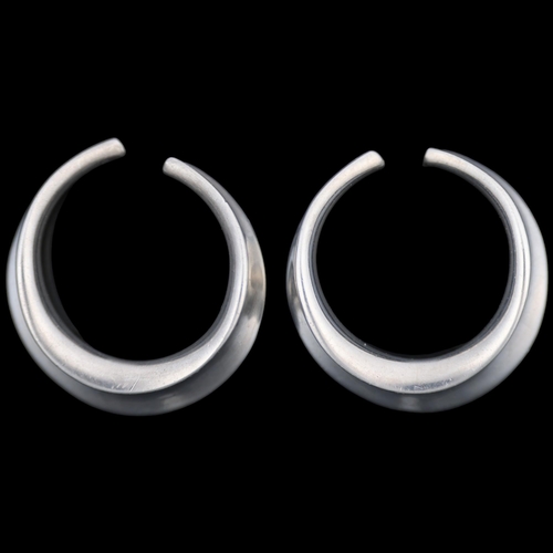 1482 - PALLE BISGAARD - a pair of Danish modernist sterling silver ear cuffs, plain circular concave form, ... 