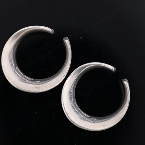 1482 - PALLE BISGAARD - a pair of Danish modernist sterling silver ear cuffs, plain circular concave form, ... 