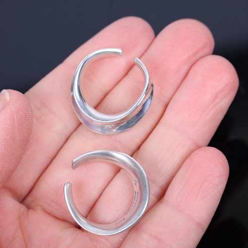 1482 - PALLE BISGAARD - a pair of Danish modernist sterling silver ear cuffs, plain circular concave form, ... 