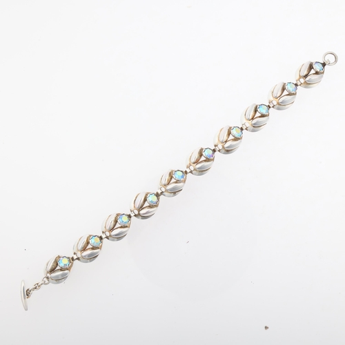 1495 - HERMANN SIERSBOL - a Danish modernist sterling silver and iridescent crystal floral panel bracelet, ... 