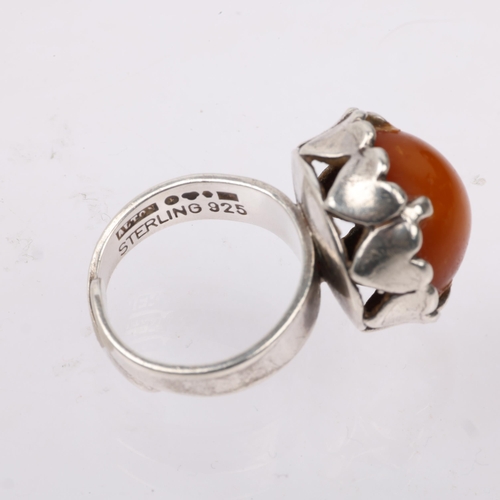 1496 - ALTON - a Swedish modernist sterling silver and butterscotch amber heart dress ring, circa 1974, set... 