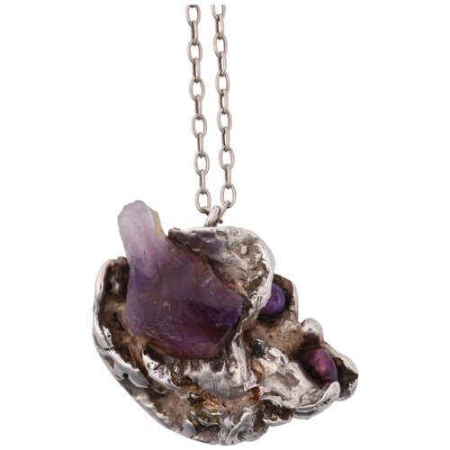 1505 - A Danish brutalist amethyst crystal and pearl abstract pendant necklace, apparently unmarked, on sil... 