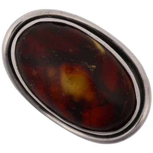 1515 - CARL OVE FRYDENSBERG - a large Danish modernist sterling silver amber dress ring, setting height 32.... 