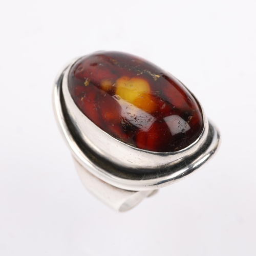 1515 - CARL OVE FRYDENSBERG - a large Danish modernist sterling silver amber dress ring, setting height 32.... 