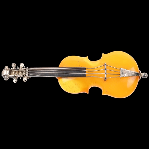 1518 - An Antique novelty amber violin brooch, with unmarked silver settings, 75.5mm, 10g