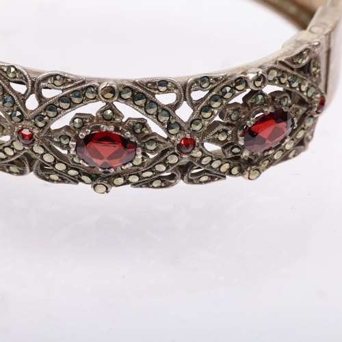 1520 - A mid-20th century silver garnet and marcasite hinged bangle, maker NCR Co, Birmingham 1958, band wi... 