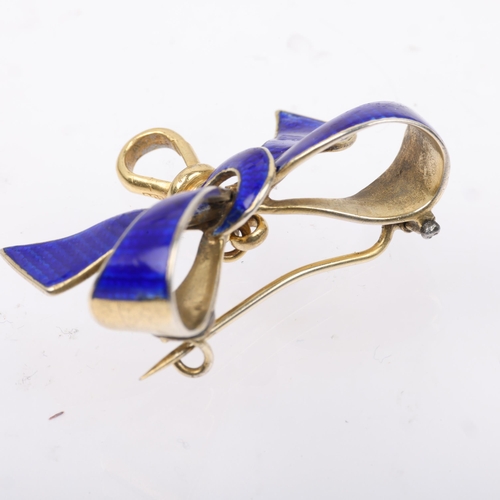 1521 - A Continental silver-gilt blue enamel ribbon bow brooch, with 9ct gold dog-clip, 34.6mm, 6.6g