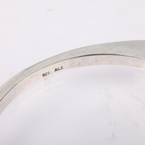 1527 - PANDORA - a sterling silver Reuleaux triangle slave bangle, band width 5.3mm, internal circumference... 