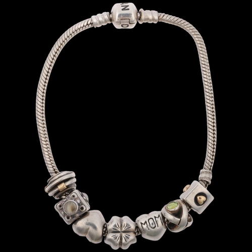 1528 - PANDORA - a sterling silver snake link charm bracelet, with 7 silver charms, 21cm, 37.5g