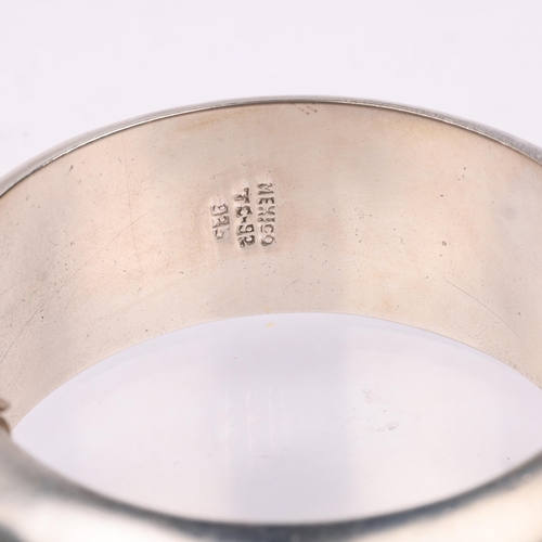 1530 - A large Mexican modernist sterling silver hinged bangle, with pierced decoration, band width 26.1mm,... 