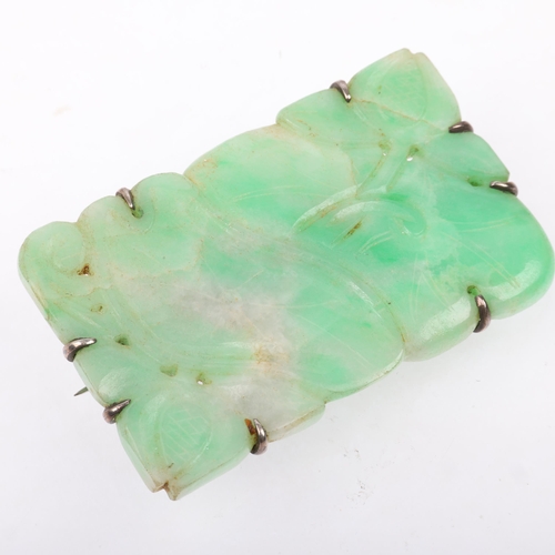 1533 - An early 20th century carved and polished jade floral panel brooch, apparently unmarked, 60.1mm, 32.... 