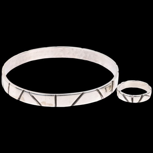 1550 - DEN-PERMANENTE - a Danish modernist sterling silver handicraft matching slave bangle and band ring, ... 