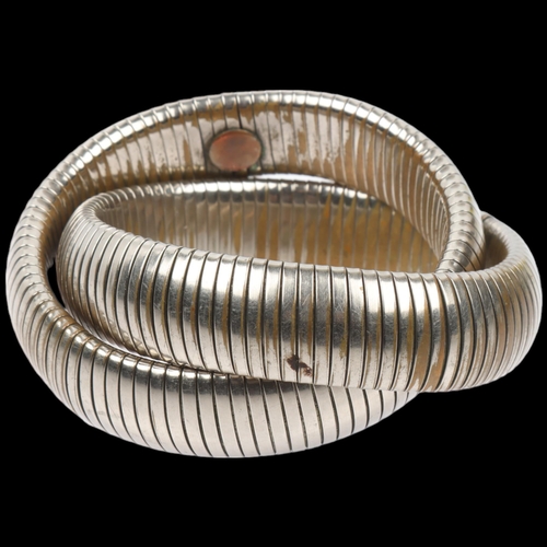 1579 - ATTRIBUTED TO BUTLER & WILSON - a Vintage expanding double twist bangle, internal circumference appr... 