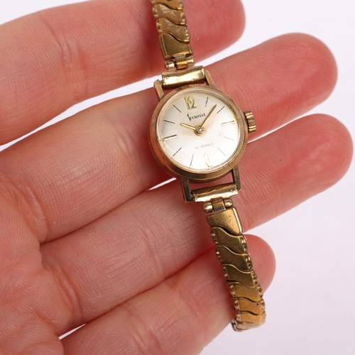1037 - ACCURIST - a lady's 9ct gold mechanical wristwatch, circa 1960s, silvered dial with gilt halfly Arab... 