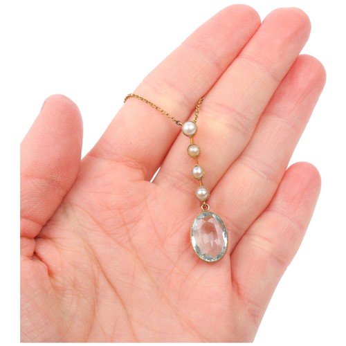 1253A - An Edwardian aquamarine and split pearl line pendant necklace, rub-over set with 4.35ct oval mixed-c... 