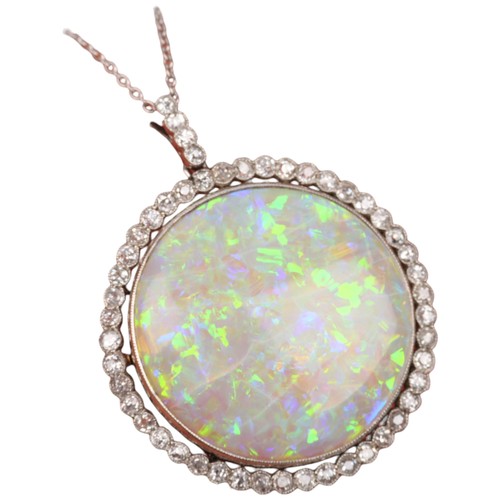 1125 - A Belle Epoque opal and diamond cluster pendant necklace, rub-over set with 15ct round cabochon opal... 