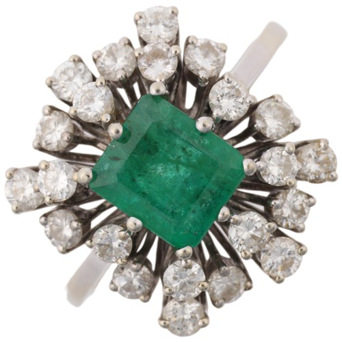 1162 - A late 20th century 18ct white gold emerald and diamond cluster cocktail ring, centrally claw set wi... 