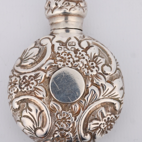 1614 - A Victorian silver moon scent flask, Saunders & Shepherd, Chester 1890, allover relief embossed flor... 