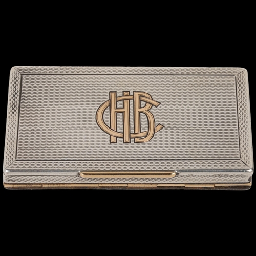 1629 - An Art Deco George V novelty silver and gold inlaid 'Trick' dual opening Vesta case, Alfred Clark, L... 