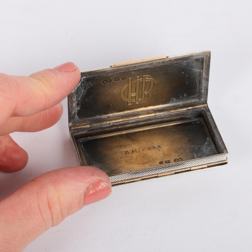 1629 - An Art Deco George V novelty silver and gold inlaid 'Trick' dual opening Vesta case, Alfred Clark, L... 