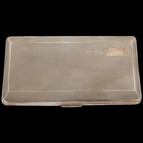 1632 - An Art Deco style George VI silver rectangular cigarette case, Harman Brothers, Birmingham 1951, all... 