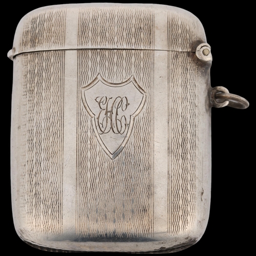 1635 - A George V curved silver Vesta case, Joseph Gloster Ltd, Birmingham 1925, rectangular form with allo... 