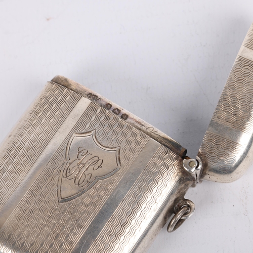 1635 - A George V curved silver Vesta case, Joseph Gloster Ltd, Birmingham 1925, rectangular form with allo... 