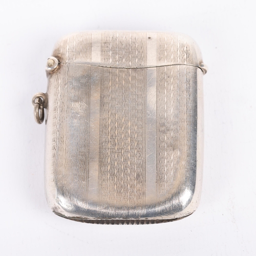 1635 - A George V curved silver Vesta case, Joseph Gloster Ltd, Birmingham 1925, rectangular form with allo... 