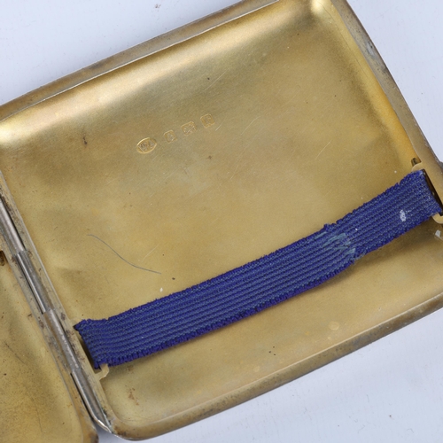 1638 - A George V curved silver cigarette case, William Aitken, Birmingham 1916, square form with allover f... 