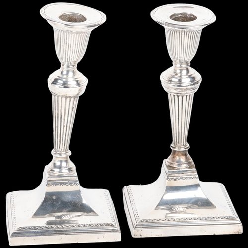 1670 - A pair of late Victorian silver table candlesticks, Richard Hodd & Son, London 1896, in the Sheritan... 