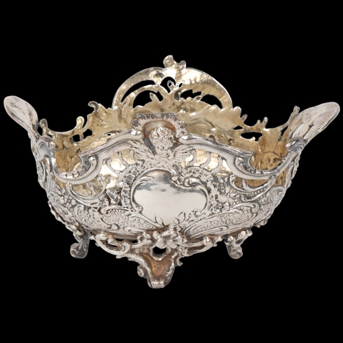 1686 - A 19th century German silver bon bon basket, Berthold Muller, import London 1894, relief embossed an... 