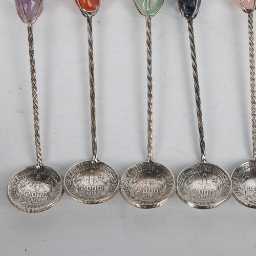 1699 - A set of 6 Brazilian silver 2000 Reis coin coffee spoons, each set with hardstone terminal and spira... 