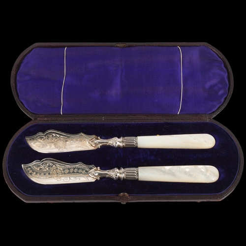 1706 - A pair of Victorian silver mother-of-pearl handled butter knives, Harrison Brothers & Howson, Sheffi... 