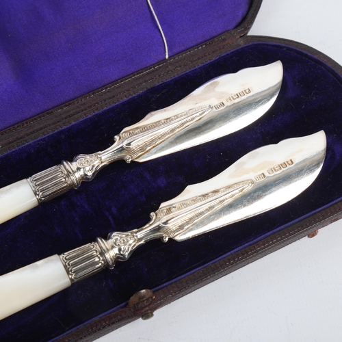 1706 - A pair of Victorian silver mother-of-pearl handled butter knives, Harrison Brothers & Howson, Sheffi... 