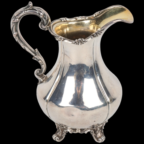 1717 - An early Victorian silver pumpkin cream jug, Richard Devonshire, London 1848, baluster form with cas... 