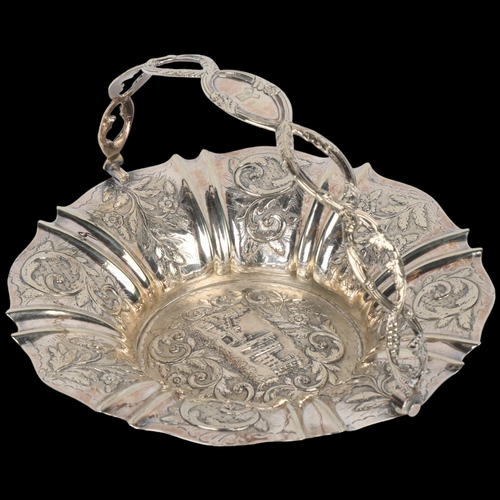 1721 - A Victorian unmarked silver 'Castle Top' swing handled cake basket, no maker, circa 1840, relief emb... 