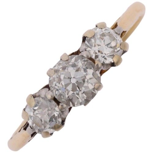 1314 - An early 20th century 18ct gold three stone diamond ring, claw set with old European-cut diamonds, t... 