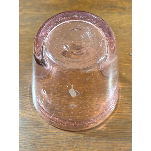 239 - MARJA HEPO-AHO, Finland, a small vase in pink glass with controlled bubbles produced with a hedgehog... 