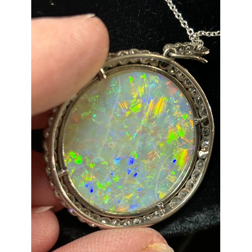 1125 - A Belle Epoque opal and diamond cluster pendant necklace, rub-over set with 15ct round cabochon opal... 