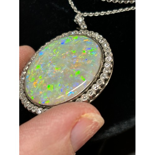 1125 - A Belle Epoque opal and diamond cluster pendant necklace, rub-over set with 15ct round cabochon opal... 