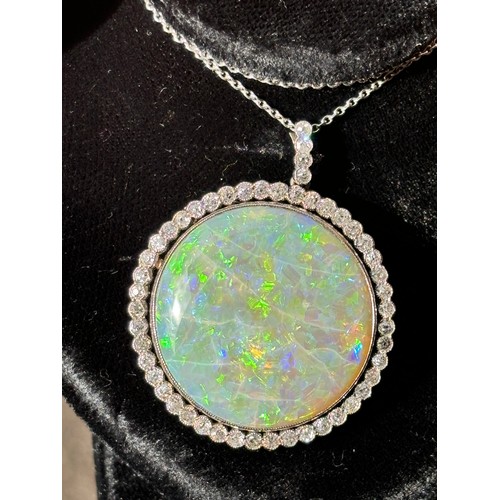 1125 - A Belle Epoque opal and diamond cluster pendant necklace, rub-over set with 15ct round cabochon opal... 