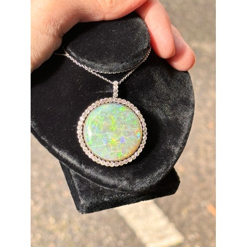 1125 - A Belle Epoque opal and diamond cluster pendant necklace, rub-over set with 15ct round cabochon opal... 