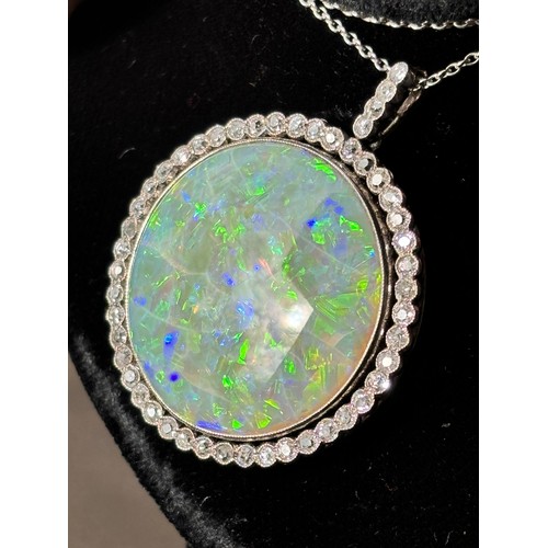 1125 - A Belle Epoque opal and diamond cluster pendant necklace, rub-over set with 15ct round cabochon opal... 