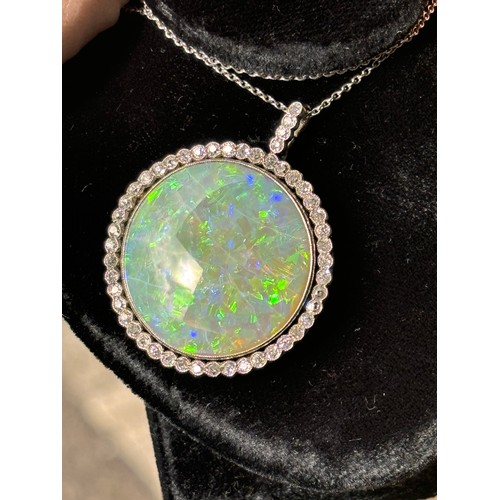 1125 - A Belle Epoque opal and diamond cluster pendant necklace, rub-over set with 15ct round cabochon opal... 