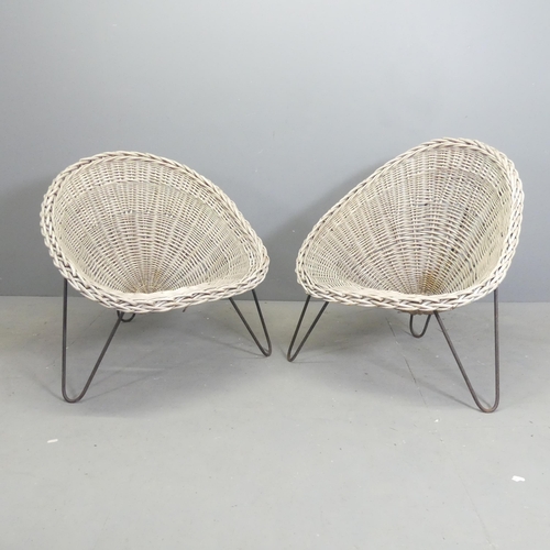 93 - A pair of mid-century style rattan cone chairs designed by Terence Conran.