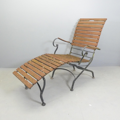 97 - A vintage teak slatted steamer lounge chair on folding iron base.