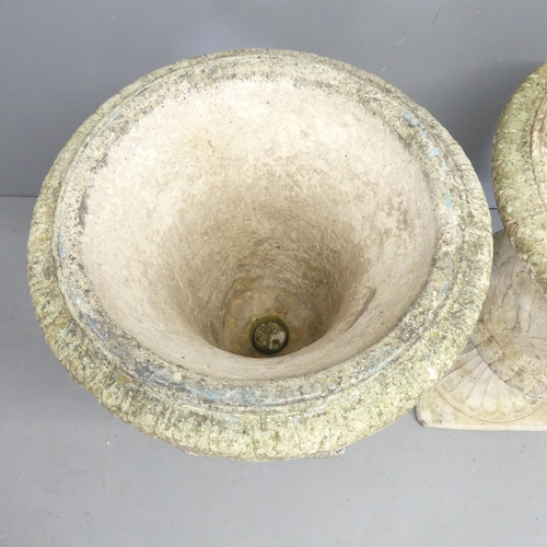 98 - A pair of reconstituted stone two-section Grecian design garden urns on stands. 65x90cm.