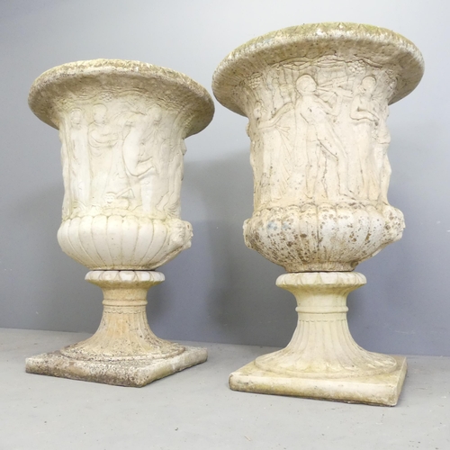 98 - A pair of reconstituted stone two-section Grecian design garden urns on stands. 65x90cm.